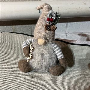 Gray and Brown Plush Toy with Striped Arms